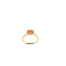 A heart-shaped lab-grown diamond bezel solitaire ring in yellow gold.