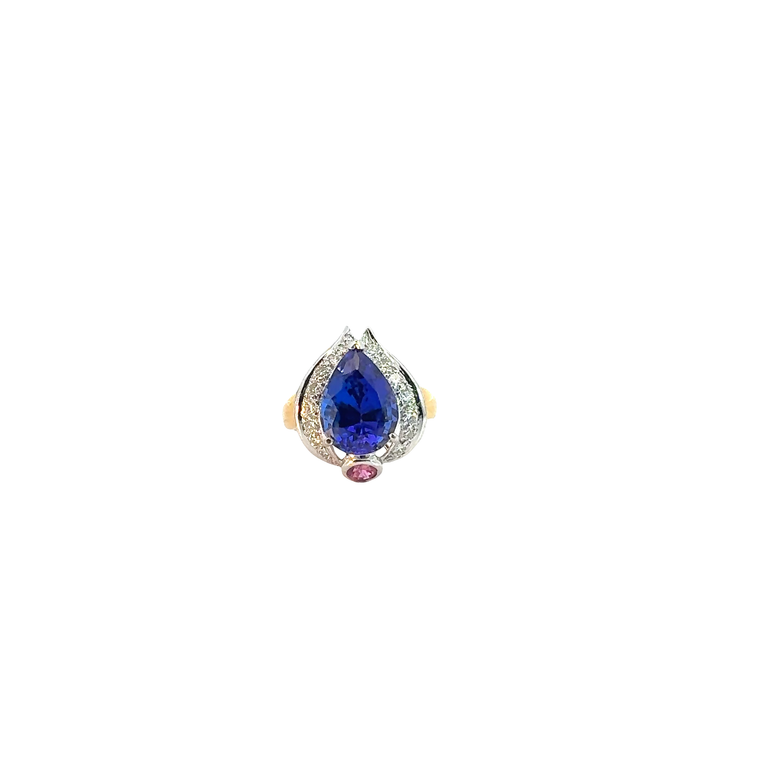 A pear-cut Tanzanite cocktail ring in a two-tone design.