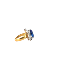 A pear-cut Tanzanite cocktail ring in a two-tone design.