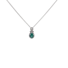 Oval Emerald and Diamond Halo Pendant Necklace in White Gold