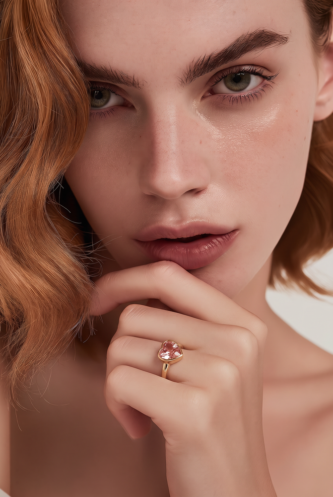 A heart-shaped lab-grown diamond bezel solitaire ring in yellow gold.