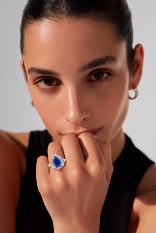 A pear-cut Tanzanite cocktail ring in a two-tone design.