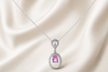 Oval Pink Sapphire Halo Pendant Necklace in White Gold