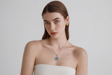Blue Sapphire Heart Halo Pendant in White Gold