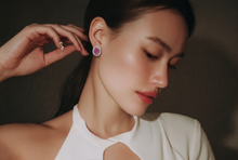 Oval Ruby and White Gold Halo Stud Earrings