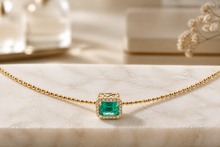 Emerald Halo Pendant on Yellow Gold Beaded Necklace