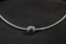 Blue Sapphire and Diamond Halo Necklace in White Gold