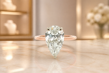 Gold Solitaire Ring with Pear Cut Diamond