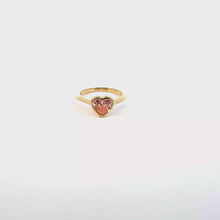 A heart-shaped lab-grown diamond bezel solitaire ring in yellow gold.