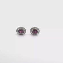 Oval Purplish-Red Ruby Halo Stud Earrings in White Gold
