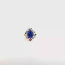 A pear-cut Tanzanite cocktail ring in a two-tone design.