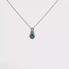 Oval Emerald and Diamond Halo Pendant Necklace in White Gold